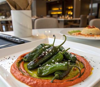 Blistered Padrón Peppers With Red Pepper Hummus (V)